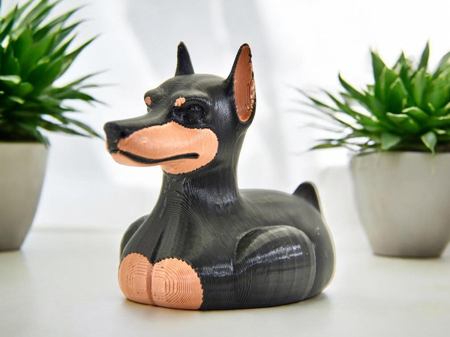 Doberman dog duck figurine