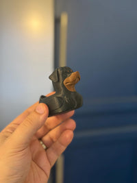 Rottweiler dog duck figurine