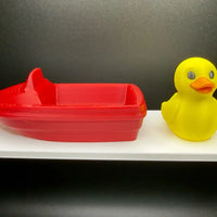 Cruise hiding duck in a colorful motorboat