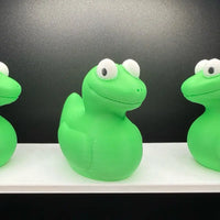 Green lizard meme duck with wide eyes and goofy smile