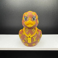 Designer monogram duck figurine side view