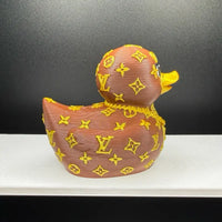 Brown and gold designer duck on display