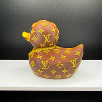 Louis Vuitton-inspired duck on a car dashboard