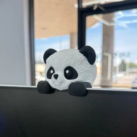 3D printed panda screen sitter perched on a monitor edge